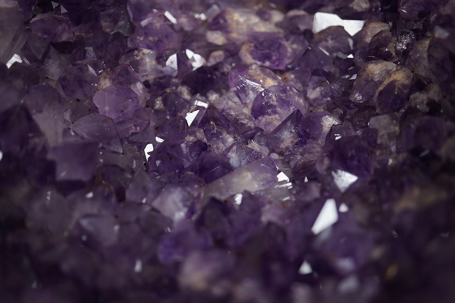 An amethyst geode specimen, 21.5cm high, 20.5cm wide at the base. Condition - fair to good.